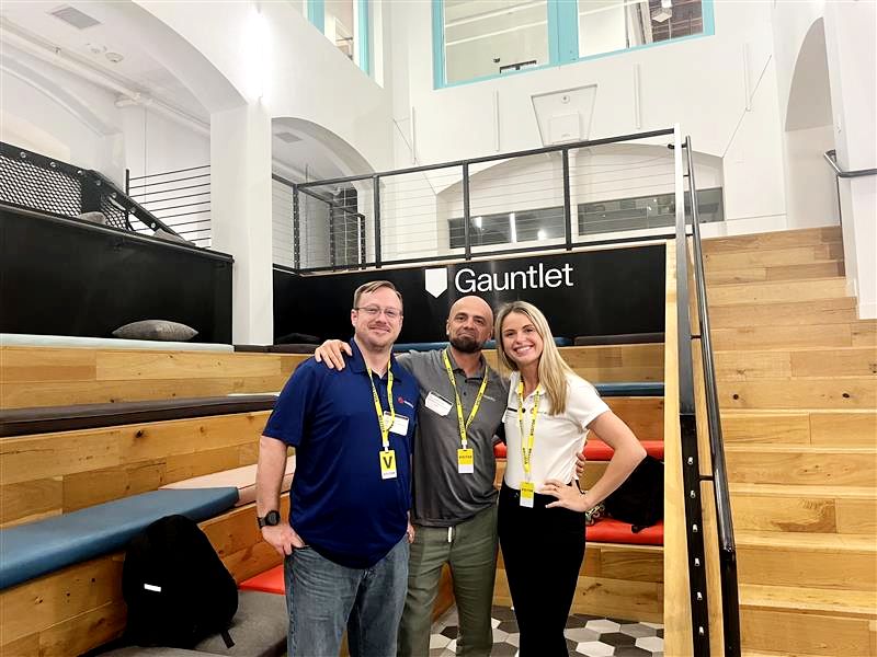Three Gauntlet fellows by the Gauntlet sign